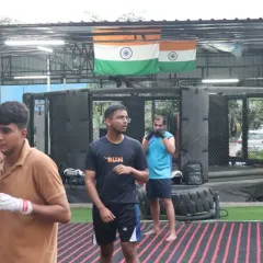 Students practice their boxing stance and movement. Footwork and head movement are just as important as throwing a punch.