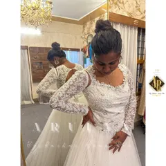 A fitting session with our beautiful bride. Ensuring the gown fits perfectly is the most important step in creating her dream wedding dress.