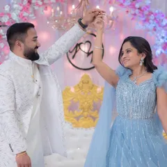 A fairytale moment from an engagement party. The bride is wearing a stunning blue gown, and I created a soft glam makeup look with romantic curls to match.