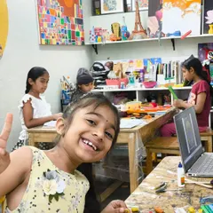 The joy of art class! This student's bright smile says it all. Our studio is a place where kids can be themselves, have fun, and let their creativity shine.