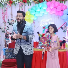 Seeing the look of wonder on a child's face is the best part of my job. Here, I'm sharing a special magical secret with my young assistant during a lively birthday party show.