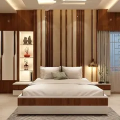 This bedroom design uses vertical wood and fabric panels to create a tall, elegant headboard wall. The built-in niche shelving with lighting is perfect for displaying small decorative items.