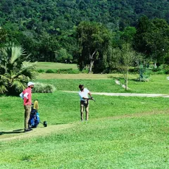 On the course with Rohan Bopanna, watching him execute a swing against the beautiful backdrop of the Coorg Golf Links.