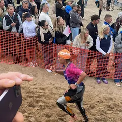 Running to T1 after the swim. I even used the "Huub breaking back tech" to get my wetsuit off quickly, a trick I learned from another swimmer. The community is all about sharing knowledge.