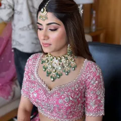 This bride is a vision in her pink lehenga. I teach how to use soft pink tones on the eyes and lips to create a dreamy, romantic look for the wedding day.