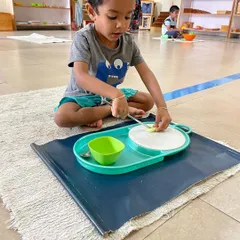 A series of images showing children engaged in food preparation. Whether it's cutting, peeling, or spooning, these activities are fundamental for developing the fine motor skills and concentration needed for writing and other complex tasks.