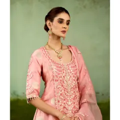 A beautifully styled shot of the pink sharara set, showcasing its flattering silhouette and elegant neckline. It’s a perfect example of modern ease meeting festive elegance.