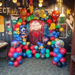 An action-packed Avengers theme for a birthday party. I built this balloon arch using the superhero colors of red, blue, green, and gold, and included foil balloons of Iron Man, Captain America, and Spider-Man.