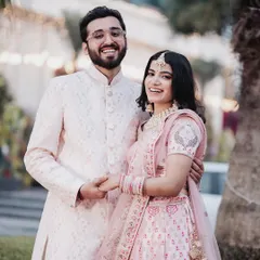 A bright and happy portrait of a couple in their engagement attire. Their wide smiles and direct look at the camera make this a wonderful, classic shot to announce their union.