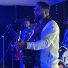 Another angle from our New Year's Eve show, capturing the dynamic between me and my bandmates. We work together to create a seamless and powerful musical experience.