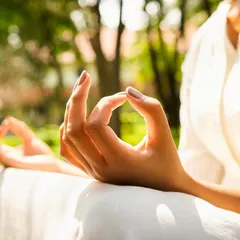 A close-up of the Gyan Mudra, a hand gesture used in meditation to increase concentration and knowledge. This simple yet powerful practice is a key part of finding mental clarity and peace at our retreat.
