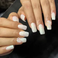 A white-on-white design with a textured finish and a delicate 3D bow accent.