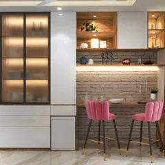 A fun and eclectic home bar setup with a brick-patterned backsplash, open wooden shelves, and vibrant pink bar stools that add a pop of color.