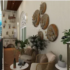 The seating area is adorned with jute wall artifacts and textured earthy paints, creating a warm, artisanal touch.