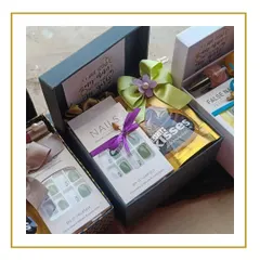 A closer look at our bridesmaid proposal boxes. These hampers include fun and useful items like press-on nails, chocolates, and satin scrunchies, with a card that asks, "I have my man, but I still need my girls!"