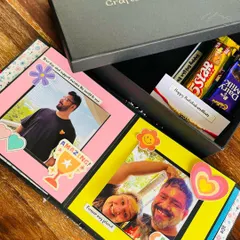 This is one of my favorite Rakhi hampers. It features a personalized scrapbook filled with childhood photos, a bar of chocolate, and a handwritten card, all presented in my signature gift box. It’s the perfect way to send love to your sibling.
