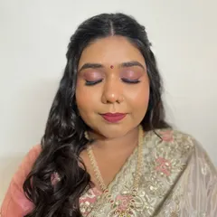 Another angle of this stunning makeup. You can see the seamless blend of the foundation and the soft glow on her cheeks.