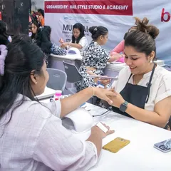 This is me in my element, doing what I love most. A candid shot of me working on a client's nails during a live event at the Beautech Expo.