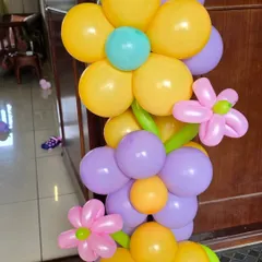 A close-up of a balloon flower column, showing the creative twisting technique used to create detailed shapes.