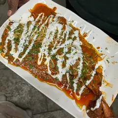 For a truly grand feast, we recommend our Tandoori Sauce Bawra. This is a whole roasted leg of lamb, smothered in a rich, tangy tandoori sauce and garnished with cream and fresh herbs. Please order this dish at least one day in advance.
