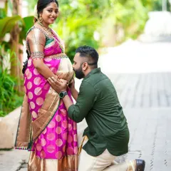 A tender moment during a traditional baby shower ceremony. We focus on capturing these quiet, unscripted interactions, like a father-to-be expressing his love, which make for truly timeless photographs.
