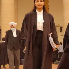 Walking through the corridors of the court, ready for a hearing. My focus is always on being prepared and presenting a confident case for my client.