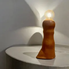 Illuminate your space with this contemporary ceramic lamp. Meticulously handcrafted, it is designed to create a warm, inviting atmosphere while serving as a stunning decorative element.