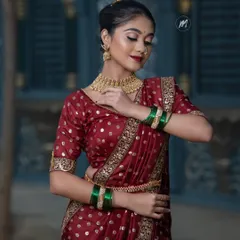 A close-up of the makeup and hairstyle that complements the Nauvari saree.