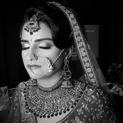 A timeless black and white portrait. This format emphasizes the structure, contour, and shimmer of the makeup, showing how well it photographs. The glitter on her eyes still shines through.