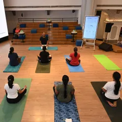 A moment of calm and focus during our on-site yoga session for Samsung India. We lead participants in Sukhasana (Easy Pose) with mindful breathing to help center the mind and prepare for a productive day, demonstrating how easily meditation can be integrated into the corporate environment.
