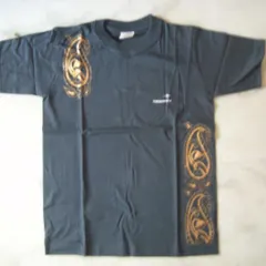 This plain grey T-shirt is transformed with golden paisley motifs painted along the side and shoulder. This custom fabric painting adds an elegant and artistic touch to everyday wear.