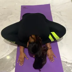 This is the full expression of Baddha Konasana, or the Bound Angle Pose, with a deep forward bend. It provides an intense stretch for the inner thighs and back, promoting relaxation and flexibility in the pelvic region.