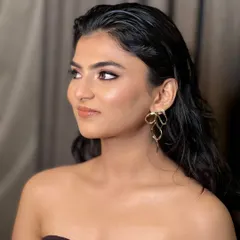 The side profile highlights the beautiful sheen on the skin and the soft contouring. This is a versatile look that enhances features naturally, making it a favorite for many of my clients.