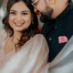 An intimate close-up of Gaurav and Mansi, capturing a moment of quiet affection. The soft focus and genuine smiles highlight the deep connection they share.