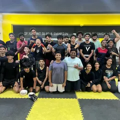 This is our family. A huge group of dedicated individuals, from beginners to seasoned fighters, all pushing each other under one roof. The words on our wall say it all: "If you want to be a champion, you need to train like one."