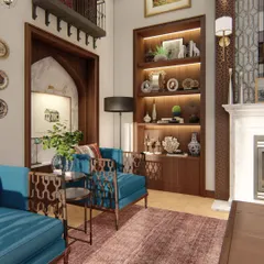A cozy corner of the haveli, where a modern blue armchair with traditional jaali-patterned sides sits next to a classic fireplace and built-in wooden bookshelf.