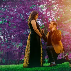 A creative and romantic outdoor maternity shot. This playful pose with a stethoscope to the belly is a sweet way for couples to celebrate their excitement and connection.