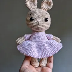 A sweet bunny doll in a pink ballerina dress, perfect for a child's room.