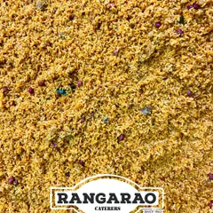 A close-up of our classic Puliyogare, a tangy and spicy tamarind rice preparation. This temple-style dish is a staple in our festive and wedding catering menus, loved for its complex flavours.