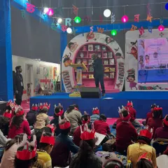 A wide shot of the caricature workshop at Pragati Maidan, organized by the National Book Trust, India. The room was filled with young, creative minds.