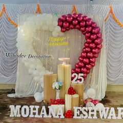 Celebrating a silver jubilee is a special milestone. I designed this heart-shaped balloon arch in chrome magenta and white for a 25th-anniversary party, complete with marquee numbers and personalized name cutouts.