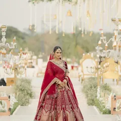 Here is my bride Janvi, walking down the aisle. Her complete look, from the flowing lehenga to the glowing makeup, was designed to be breathtaking from every angle.