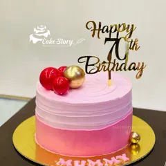 An elegant cake for a mother's 70th birthday. The pink ombre design is simple yet beautiful, topped with a 'Happy 70th Birthday' sign.