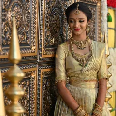 This stunning all-gold Langa Davani set was created for a client's special event. The tissue fabric gives it a beautiful sheen, and the simple, elegant blouse completes the regal look.