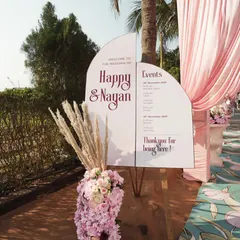 A welcome sign should be both beautiful and helpful. For this wedding, I designed a modern, two-panel sign that not only welcomed guests but also clearly displayed the event schedule, making sure no one missed a moment.