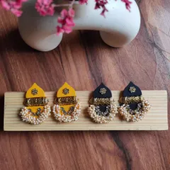 My popular temple earrings are made to order and are perfect for wedding functions. This photo shows them in both yellow for haldi and black for a classic look.