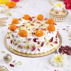 My Motichoor Ladoo cake is a festive favourite. It's a soft, moist cake infused with cardamom and saffron, topped with light cream, pistachios, rose petals, and of course, delicious motichoor ladoos.