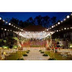 For this sangeet, I transformed an outdoor space into an enchanted wonderland under the stars. A canopy of string lights and suspended disco balls created a magical atmosphere for a night of dancing and celebration.