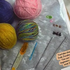 Here is what my beginner's kit looks like all packed up and ready to go. I make sure every component, from the yarn to the needles, is neatly included so you can unbox it and start your crochet journey immediately.
