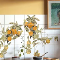 A splash of sunshine for your kitchen. These bespoke ceramic tiles feature a digitally hand-illustrated design of fresh oranges on the vine, turning a simple backsplash into a vibrant, functional piece of art that brightens the entire space.